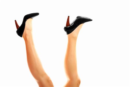 simsearch:400-04259245,k - A close-up of sexy legs in black heels over white background Fotografie stock - Microstock e Abbonamento, Codice: 400-04321259