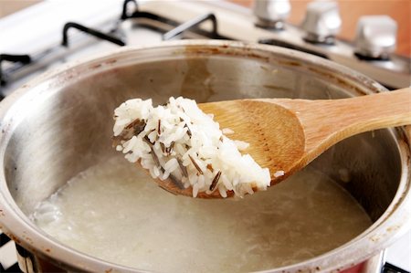 rice pan - Cooking rice on the cooker Stock Photo - Budget Royalty-Free & Subscription, Code: 400-04321286