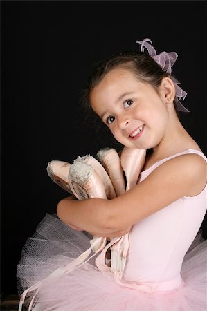 simsearch:400-07302639,k - Cute brunette ballet girl holding lots of pointe shoes Stock Photo - Budget Royalty-Free & Subscription, Code: 400-04321548