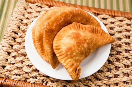 simsearch:400-04822787,k - Cheese empanada, meat empanada or chicken empanada, on a white plate.  Empanada (meat pie) - traditional snack originally from Spain. Stock Photo - Budget Royalty-Free & Subscription, Code: 400-04321672