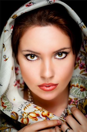 Portrait of beautiful girl  with old russian shawl on head on black background. Retouched Stock Photo - Budget Royalty-Free & Subscription, Code: 400-04321891