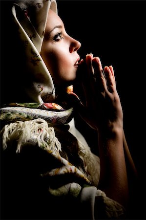 rettich - Portrait of beautiful praying girl with old russian shawl on head on black background. Retouched Stock Photo - Budget Royalty-Free & Subscription, Code: 400-04321892