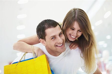 simsearch:400-04323202,k - Portrait of a young smiling couple with shopping Stock Photo - Budget Royalty-Free & Subscription, Code: 400-04322098