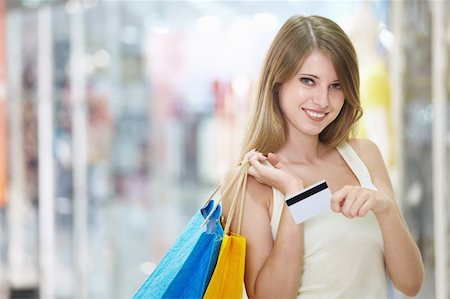 simsearch:400-04323202,k - Young attractive girl with shopping and credit card in store Stock Photo - Budget Royalty-Free & Subscription, Code: 400-04322108