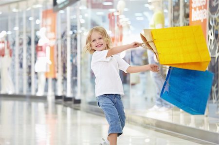 A little girl with the packages in the shop Stock Photo - Budget Royalty-Free & Subscription, Code: 400-04322126