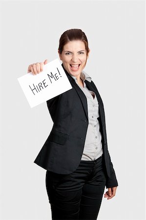simsearch:400-04648812,k - Business woman holding a card board with the text message "Hire me" Stock Photo - Budget Royalty-Free & Subscription, Code: 400-04322225