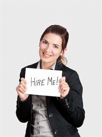 simsearch:400-04648812,k - Business woman holding a card board with the text message "Hire me". Stock Photo - Budget Royalty-Free & Subscription, Code: 400-04322221