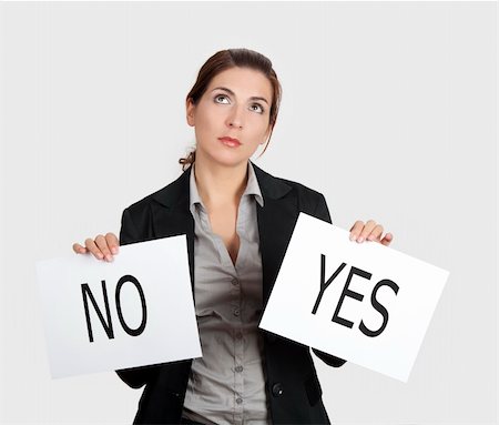 Business young woman trying to make a decision between Yes or No choice Stock Photo - Budget Royalty-Free & Subscription, Code: 400-04322245
