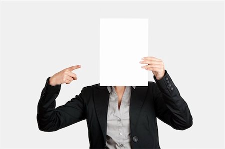 simsearch:400-05718227,k - Woman showing and pointing to a  blank paper sheet in front of her head Stock Photo - Budget Royalty-Free & Subscription, Code: 400-04322250