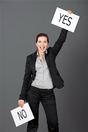 Business young woman choosing the Yes choice, over a gray background Stock Photo - Budget Royalty-Free & Subscription, Code: 400-04322266