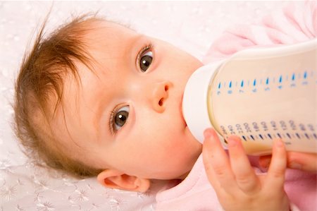 Adorable Seven month Baby eating from bottle Stock Photo - Budget Royalty-Free & Subscription, Code: 400-04322357