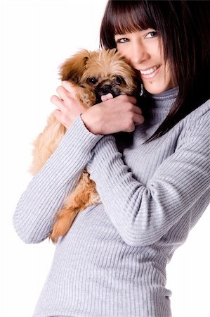 Brunette woman with a cute little pekingese Stock Photo - Budget Royalty-Free & Subscription, Code: 400-04322376