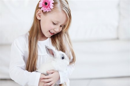 Little girl holding a fluffy white rabbit Stock Photo - Budget Royalty-Free & Subscription, Code: 400-04323147