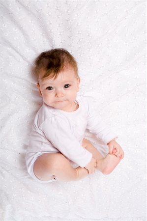 Adorable Seven month Baby girl wearing pink suite Stock Photo - Budget Royalty-Free & Subscription, Code: 400-04323310