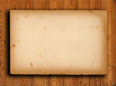 scrolled up paper - old paper on brown wood texture with natural patterns Stock Photo - Budget Royalty-Free & Subscription, Code: 400-04323614