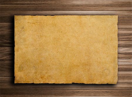 scrolled up paper - old paper on brown wood texture with natural patterns Stock Photo - Budget Royalty-Free & Subscription, Code: 400-04323616
