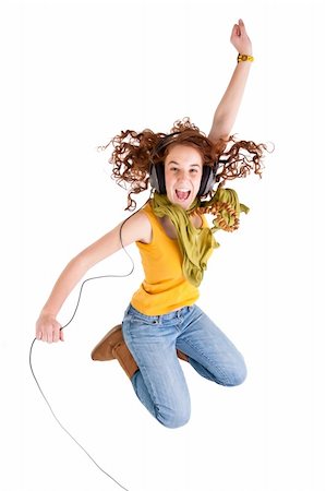 Beautiful teen girl, yellow t-shirt and jeans, jump Stock Photo - Budget Royalty-Free & Subscription, Code: 400-04323836