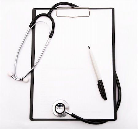 doctor reading paper - blank clipboard and pen with stethoscope Stock Photo - Budget Royalty-Free & Subscription, Code: 400-04323999