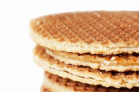 A stack of golden round waffles with caramel isolated over white background. Stock Photo - Budget Royalty-Free & Subscription, Code: 400-04334199