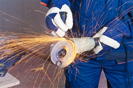 simsearch:400-04856931,k - A man working with grinder, close up on tool, hands and sparks, real situation picture Foto de stock - Royalty-Free Super Valor e Assinatura, Número: 400-04334210