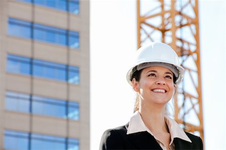 Smiling woman working on construction Stock Photo - Budget Royalty-Free & Subscription, Code: 400-04334253