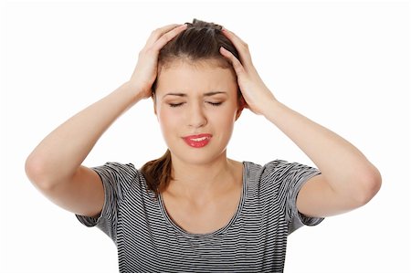 simsearch:400-07485414,k - Teen woman with headache holding her hand to the head, isolated on white Fotografie stock - Microstock e Abbonamento, Codice: 400-04334576