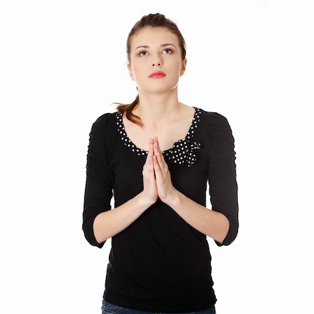 Closeup portrait of a young caucasian woman praying isolated on white background Stock Photo - Budget Royalty-Free & Subscription, Code: 400-04334579