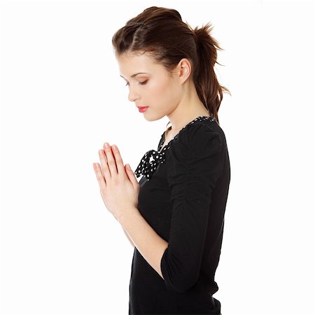 Closeup portrait of a young caucasian woman praying isolated on white background Stock Photo - Budget Royalty-Free & Subscription, Code: 400-04334581