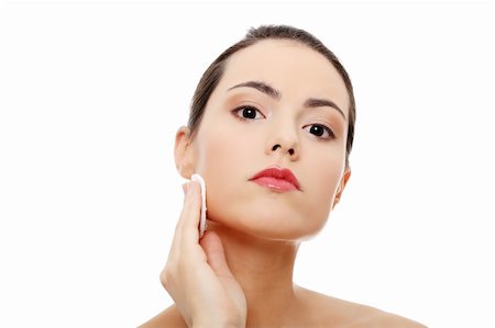 Young beautiful caucasian woman using a cotton pad to remove her make-up. Isolated on white Stock Photo - Budget Royalty-Free & Subscription, Code: 400-04334877