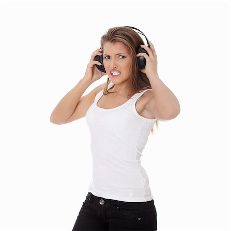 simsearch:400-05349451,k - Emotional portrait of teen girl listening aggressive music in headphones Foto de stock - Super Valor sin royalties y Suscripción, Código: 400-04335823