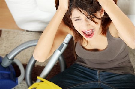 Young woman hates cleaning home. Stock Photo - Budget Royalty-Free & Subscription, Code: 400-04335872
