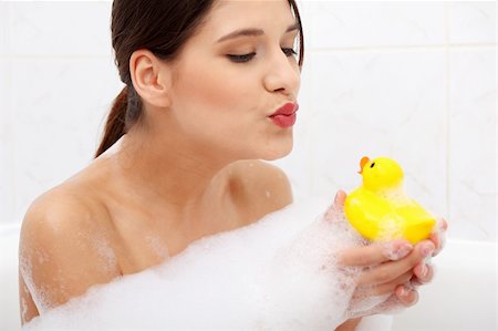 Beautiful young caucasian woman taking a bath with yellow duck. Stock Photo - Budget Royalty-Free & Subscription, Code: 400-04336001