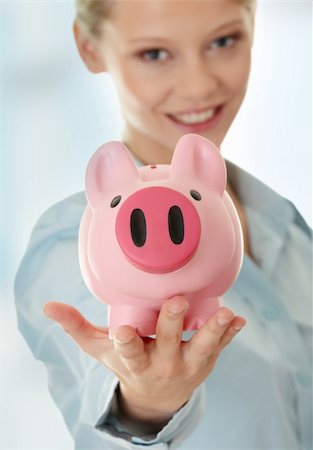 Young beautiful woman standing with piggy bank (money box). Stock Photo - Budget Royalty-Free & Subscription, Code: 400-04336226
