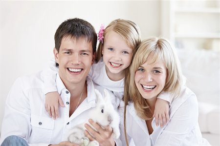 Portrait of young happy family at home Stock Photo - Budget Royalty-Free & Subscription, Code: 400-04336333