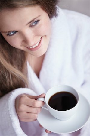 A young girl holding a cup of coffee close up Stock Photo - Budget Royalty-Free & Subscription, Code: 400-04336463