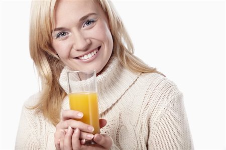 fresh face female in her thirties smiling - Attractive girl with a glass of juice on a white background Stock Photo - Budget Royalty-Free & Subscription, Code: 400-04336621