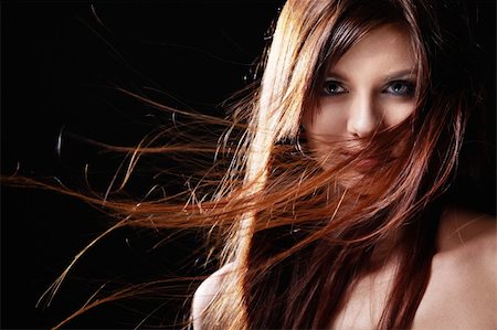 simsearch:400-06482471,k - Beautiful girl with flowing hair on a black background Stock Photo - Budget Royalty-Free & Subscription, Code: 400-04336649