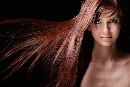 Beautiful girl with flowing hair on a black background Stock Photo - Budget Royalty-Free & Subscription, Code: 400-04336652