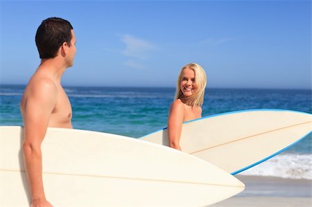 simsearch:400-05319489,k - Couple with their surfboards Stock Photo - Budget Royalty-Free & Subscription, Code: 400-04336817