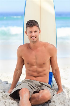 simsearch:400-05319489,k - Handsome man with his surfboard Stock Photo - Budget Royalty-Free & Subscription, Code: 400-04336837