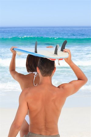 simsearch:400-05319489,k - Lovers with their surfboard Stock Photo - Budget Royalty-Free & Subscription, Code: 400-04336869