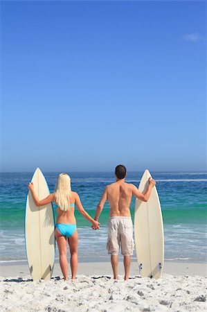 simsearch:400-05319489,k - Lovers with their surfboards Stock Photo - Budget Royalty-Free & Subscription, Code: 400-04336892