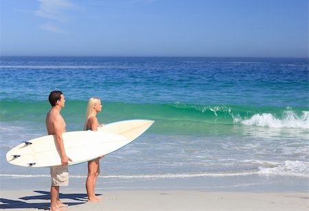 simsearch:400-05319489,k - Lovers with their surfboards Stock Photo - Budget Royalty-Free & Subscription, Code: 400-04336934