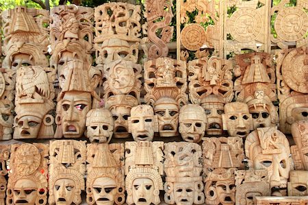 Mayan wood mask rows Mexico handcraft faces indian culture Stock Photo - Budget Royalty-Free & Subscription, Code: 400-04337031