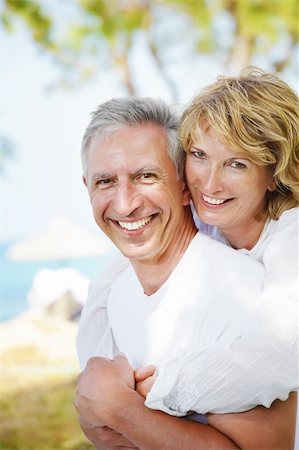 Happy mature couple smiling and embracing. Stock Photo - Budget Royalty-Free & Subscription, Code: 400-04337294