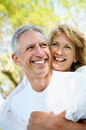 Happy mature couple smiling and embracing. Foto de stock - Royalty-Free Super Valor e Assinatura, Número: 400-04337291