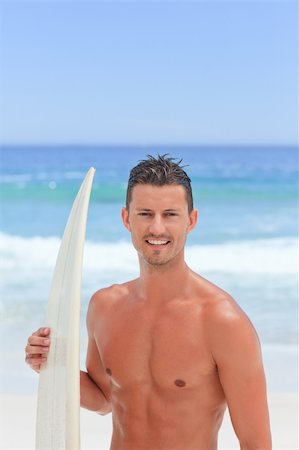 simsearch:400-05319489,k - Man posing with his surfboard Stock Photo - Budget Royalty-Free & Subscription, Code: 400-04337706