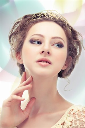 diadème - Young majestic woman in a diadem of gold on abstract background. Stock Photo - Budget Royalty-Free & Subscription, Code: 400-04338149