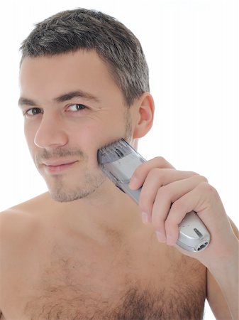 simsearch:400-04594366,k - Young handsome male shaving face beard . isolated on white background Photographie de stock - Aubaine LD & Abonnement, Code: 400-04339044