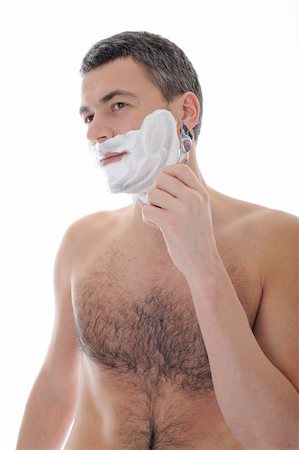 simsearch:400-04594366,k - Young handsome male  shaving face beard . isolated on white background Photographie de stock - Aubaine LD & Abonnement, Code: 400-04339046